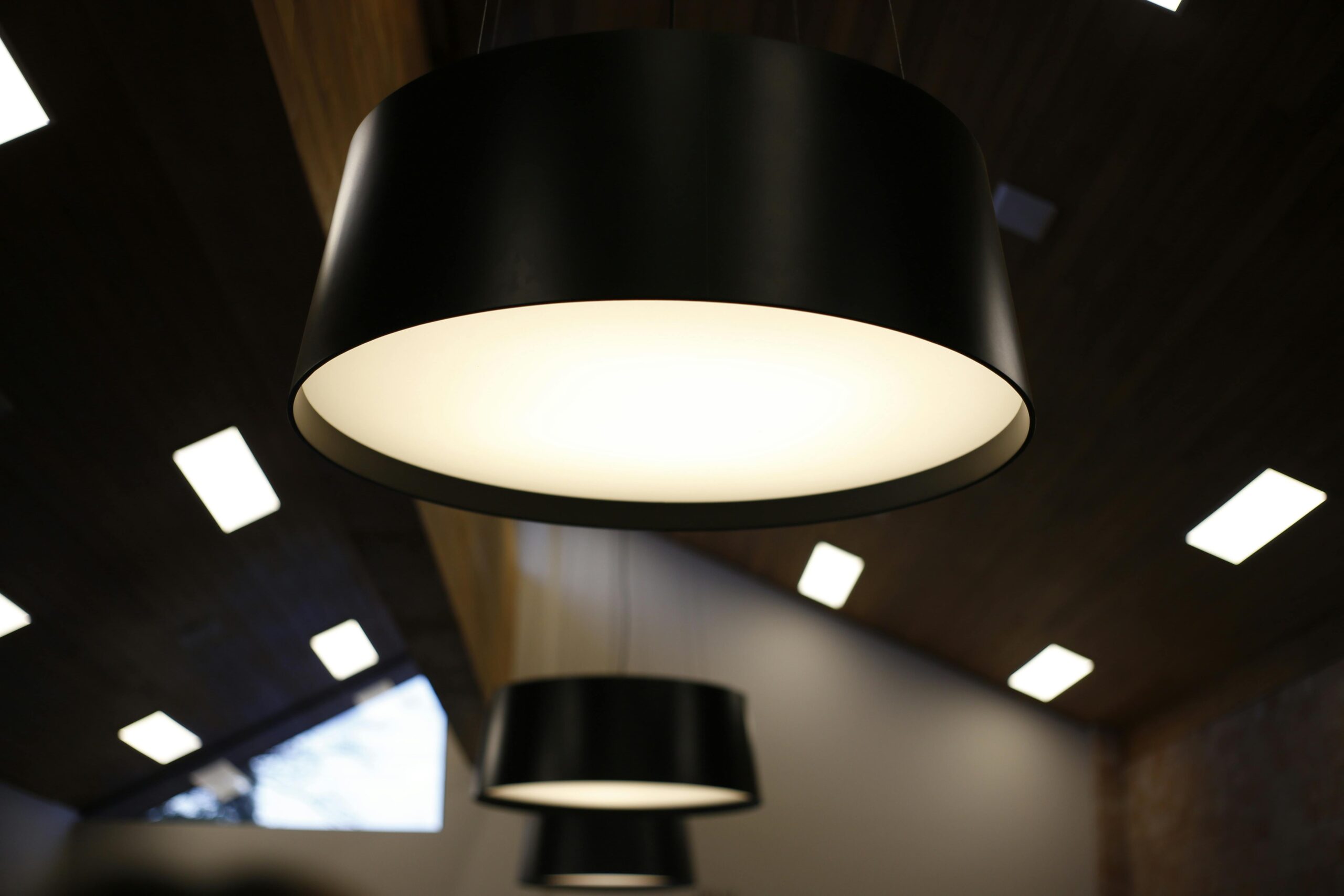 Close-up of modern ceiling lights in a stylish, contemporary interior space.
